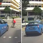 Boy sent flying after getting hit by taxi while crossing road on kick scooter in Bugis