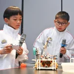 Primary school duo head to global robotics competition with robot ‘buddy’ that monitors screen time