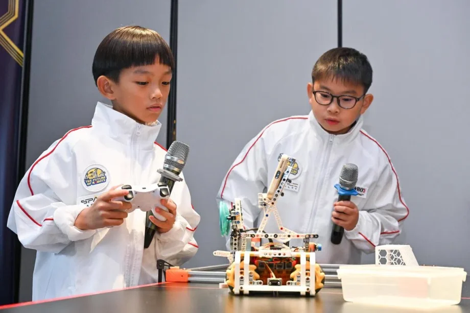 Primary school duo head to global robotics competition with robot ‘buddy’ that monitors screen time