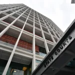 Malaysian man charged with involvement in government official impersonation scam