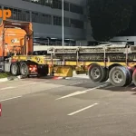 Driver assisting with investigations after trailer gets stuck on centre divider, blocks traffic for over 2 hours