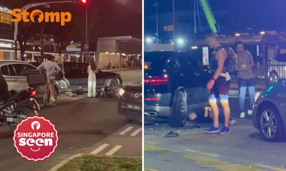 Motorcyclist lies under car after Alexandra Road accident, woman assisting with investigations