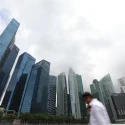 With S$/US$ parity on horizon, should investors go long on Singapore real estate, short overseas property?