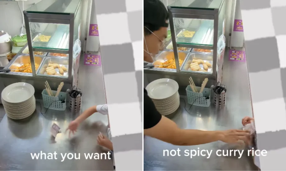 Stall owner gently tells off primary school boy who throws money while ordering food Stall owner gently tells off primary school boy who throws money while ordering food