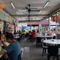 Woman with kids chased away from reserved tables by zi char stall that pays higher rental