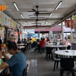 Woman with kids chased away from reserved tables by zi char stall that pays higher rental