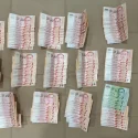 Man and teenager arrested for allegedly snatching cash from an elderly man