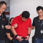 Man accused of murdering his wife in Chinatown hotel room taken back to crime scene