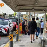 Passers-by use buckets of water to put out fire near Novena Church