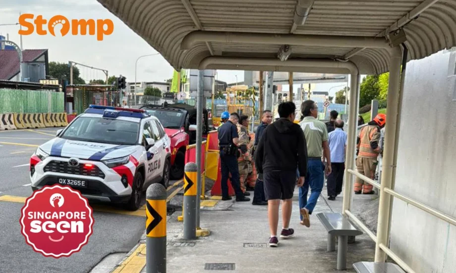 Passers-by use buckets of water to put out fire near Novena Church
