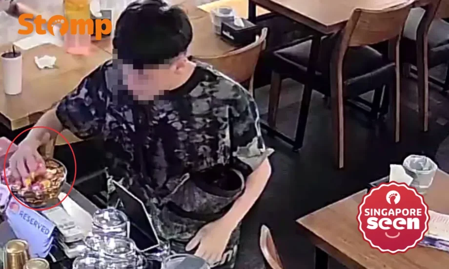 ‘Scheming’ diner stuffs huge handful of complimentary haw flakes into open bag before leaving restaurant