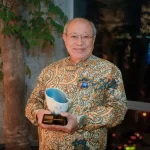 Retiree running charity given first ST Singaporean of the Year international impact award