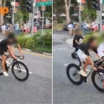 Oblivious to danger? Youths ride e-bikes and bicycles without helmets in middle of Jurong West road