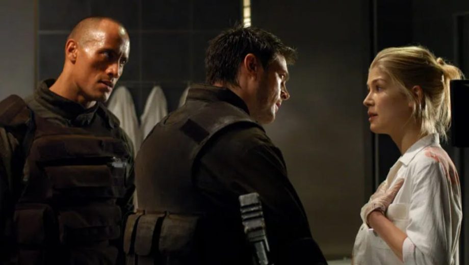 Rosamund Pike Says Her Doom Movie With The Rock Was ‘Probably One of the Worst Films Ever Made’ and ‘Could Have Ended My Career’