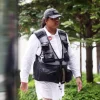 Man charged with using criminal force on Singapore police