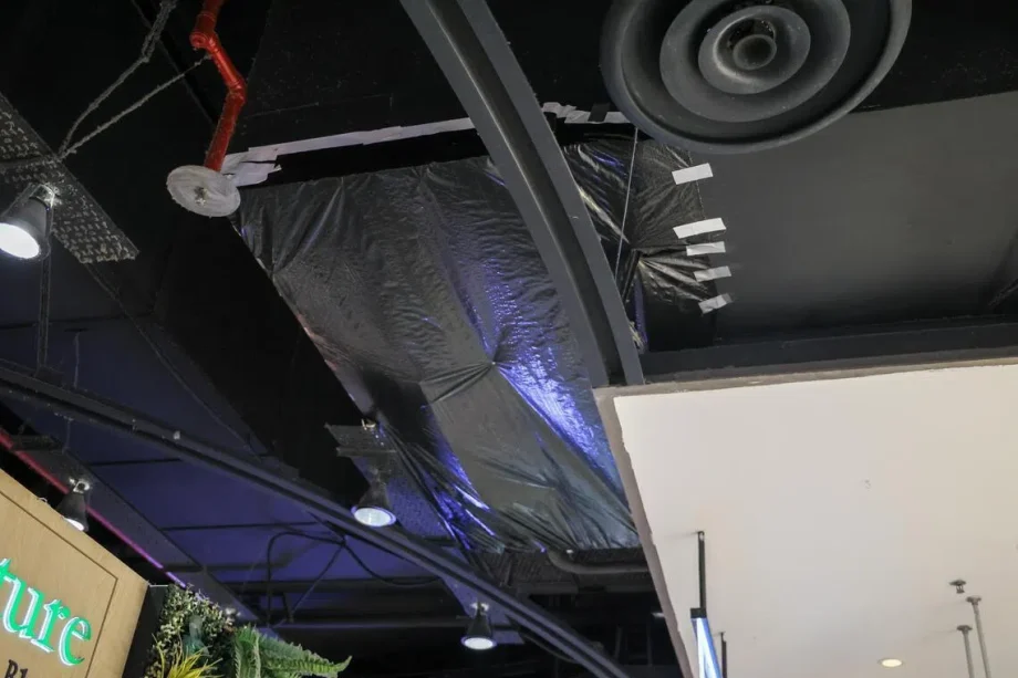 Ceiling panel in Square 2 mall falls, possibly due to prolonged moisture exposure; no injuries