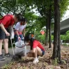 Students join migrant workers for annual beach clean-up