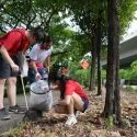 Students join migrant workers for annual beach clean-up