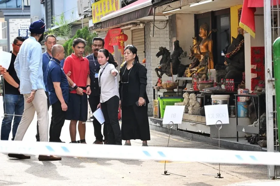 Accused in Geylang murder brought back to crime scene