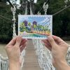 Sentosa unveils scenic posting box at Palawan Beach for visitors to send postcards worldwide