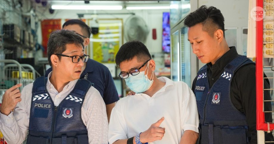 6 retailers accused of SIM card fraud brought back to crime scenes, Singapore News 6 retailers accused of SIM card fraud brought back to crime scenes, Singapore News