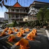 Every three steps, one bow: More than 7,000 devotees perform Buddhist ceremony to mark Vesak Day