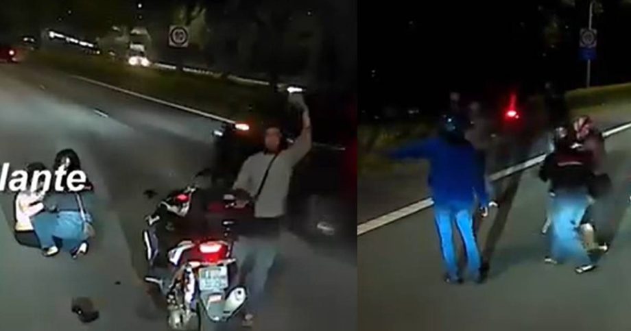Woman flunk off motorbike at TPE, assisted by other riders, Singapore News Woman flunk off motorbike at TPE, assisted by other riders, Singapore News