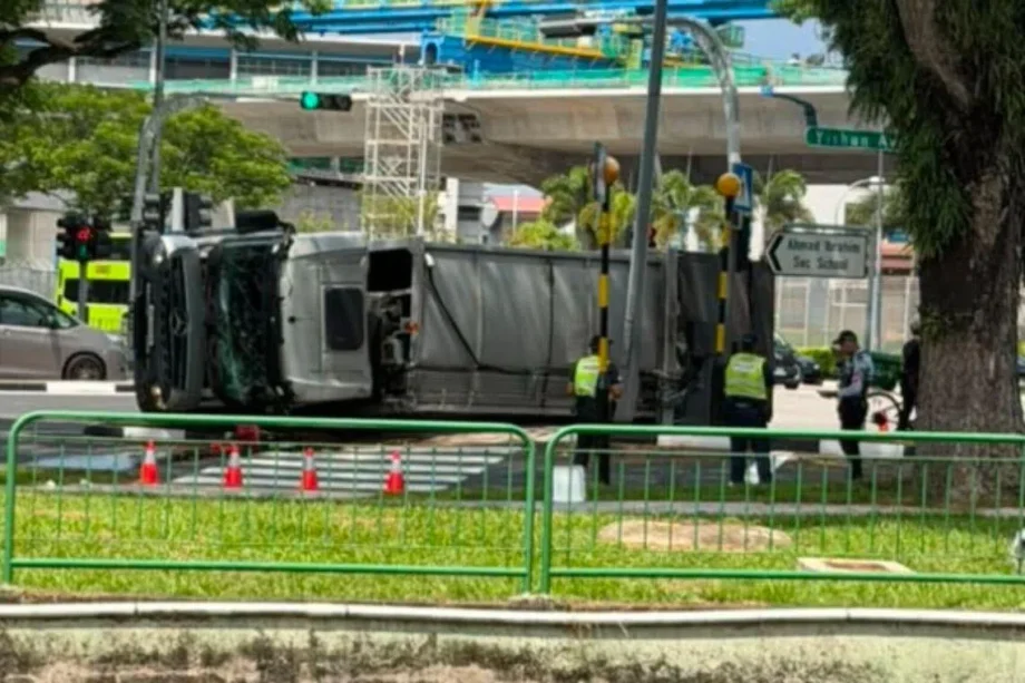 Three workers taken to hospital after garbage truck skids and flips over in Yishun Three workers taken to hospital after garbage truck skids and flips over in Yishun