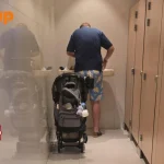 Man changing diaper at Wheelock Place women’s toilet