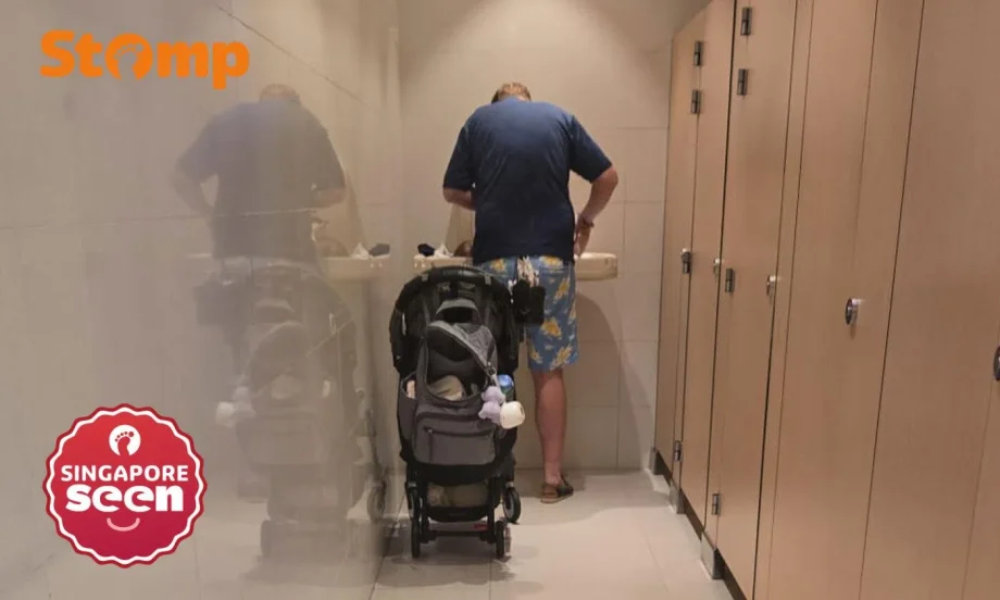 Man changing diaper at Wheelock Place women’s toilet