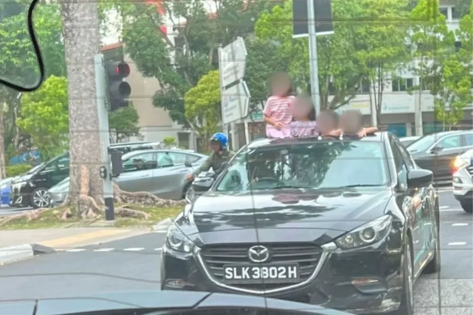 Kids seen standing through GetGo car’s sunroof Kids seen standing through GetGo car’s sunroof