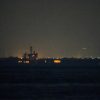 USS Lincoln sails past Singapore on its way to the Middle East after grueling 9-month deployment