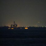 USS Lincoln sails past Singapore on its way to the Middle East after grueling 9-month deployment