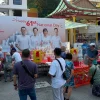 Seventh month offerings near National Day banner