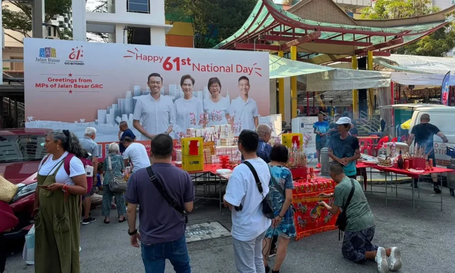 Seventh month offerings near National Day banner
