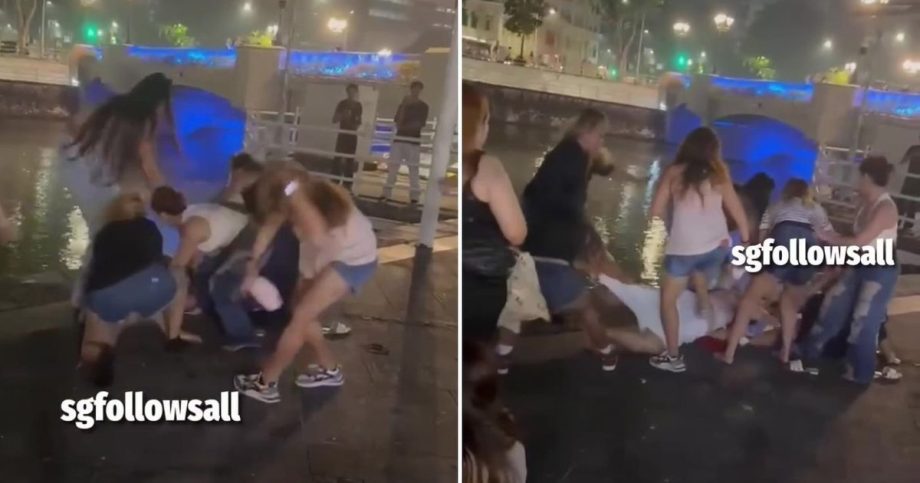 Group of women fight near Singapore River in Clarke Quay Group of women fight near Singapore River in Clarke Quay