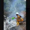 Indonesian fire fighter caught using small, watering can to put out the flames