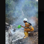 Indonesian fire fighter caught using small, watering can to put out the flames