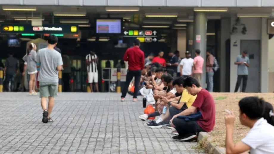 Smokers gather near Woodlands MRT station, leaving cigarette butts for others to deal with Smokers gather near Woodlands MRT station, leaving cigarette butts for others to deal with
